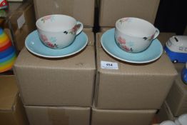 *Four Floral Lace Cups and Saucers