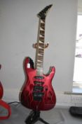 Jackson Red Electric Guitar with Stand