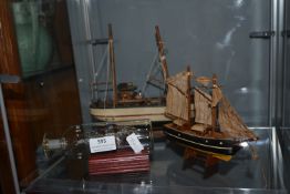 Two Model Ships and a Ship in a Bottle