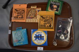 Assorted Guitar Strings and Plectrums