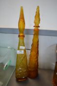 Two Orange Glass Apothecary Style Bottles