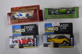 Four Diecast Classic Cars
