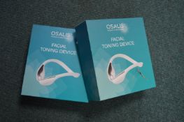 Two Osalis Facial Toning Devices