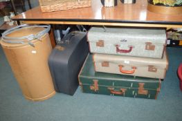 Four Vintage Suitcases and a Storage Drum