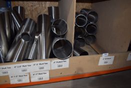 *Contents of Three Pigeonholes to Include 4” Stainless Steel Elbows and Ts