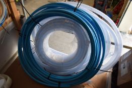 *Two Rolls of Blue Alkathene Pipe, and Three Rolls of Reinforced Clear Plastic Pipe