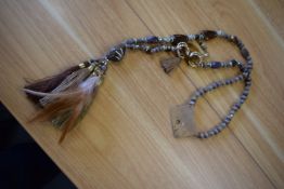 *Long Beaded Necklace in Brown