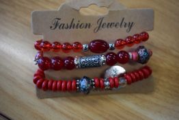 *Three Bracelets in Red