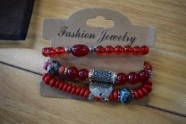 *Three Bracelets in Red