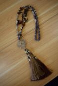 *Long Beaded Necklace in Brown