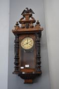 Mahogany Cased Wall Clock with Carved Eagle Design