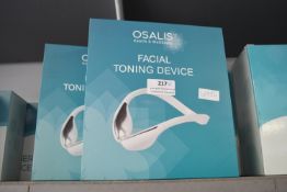 Two Osalis Facial Toning Devices