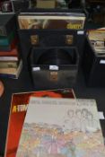 Two Record Cases Containing 12 LPs and 7” 45rpm Singles