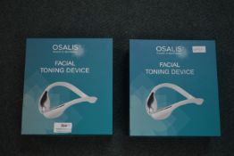 Two Osalis Facial Toning Devices