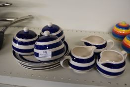 *Three Jugs, Three Sugar Pots, and Four Plates