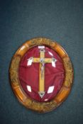 Crucifix Mounted in Oval Frame with Convex Glass