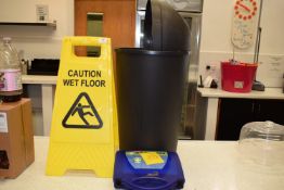 *Wet Floor Sign, Flip Top Bin, and a First Aid Kit