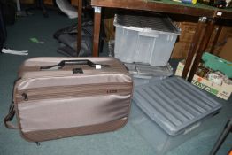 Two Storage Boxes and Delsey Travel Case
