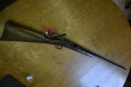 Antique Single Barrel 12G Bolt Action Shotgun Serial Number U52764 with Straight Wood Stock, signs
