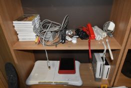 *Quantity of Assorted Wii Controllers, Games, Two Wii Consoles, Wii Mini, and a Wii Board