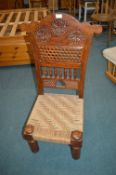 Carved Wooden Low Chair with Rattan Seat