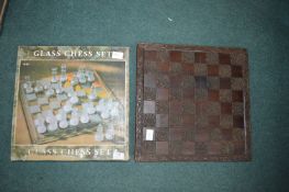 Boxed Glass Chess Set and Board, and a Carved Wood Effect Chessboard