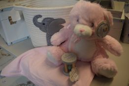 *Pink Teddy, Pink Blanket, Rattle, and a Woven Elephant Basket