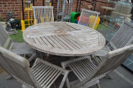 Circular Wooden Patio Table with Six Folding Chair