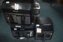 *2x Sur La Table Dual Basket Air Fryers, and a Gourmia Window Air Fryer