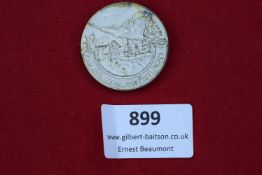 German Alps Badge, a circular pressed metal badge showing a mountain chalet scene with legend