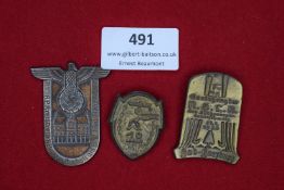 A lot of three German day badges. Comprising: a 1934 Heidekreis Parteitag example with swastika over