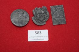 Three Hitler Youth badges, comprising: a circular badge depicting two profile busts with legend
