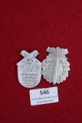 Two German Third Reich SA Day Badges, comprising a sword-through-oakleaf wreath example inscribed “
