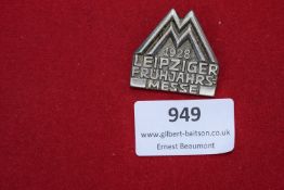 A silvered metal event badge for the Leipziger Frühjahrsmesse 1928 (Leipzig Spring Fair), struck
