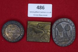 Three badges: a circular bronze badge inscribed Fest der Deutschen Schule, VDA with swastika wreath;