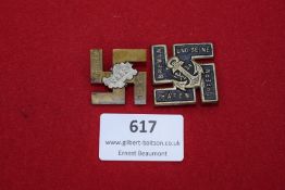 A pair of German Third Reich badges: one for the Bremen Hafen Opfern 1934, black enamelled with