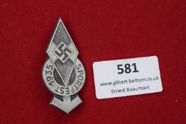 A Hitler Youth Sportsfest 1935 badge, in the form of the HJ diamond with swastika over laurel