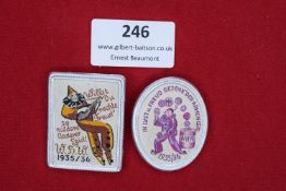 Two German tinplate WHW Badges with Cloth Fronts - 1935/36