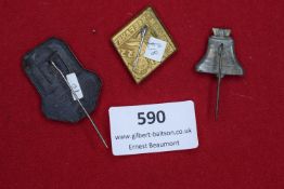 A group of three German stick pins, including: a Grenzlandtreffen 1933 badge with Iron Cross