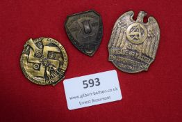 Three German Third Reich Day Badges including: circular 1935 badge with large swastika and