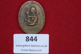 NS-Frauen-Werke bronze badge, “Gesunde Frau – Gesundes Volk” (Healthy Woman – Healthy People), dated
