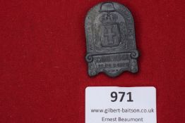 A pressed grey metal badge in shield form, for the Stahlhelm veterans’ organisation, commemorating
