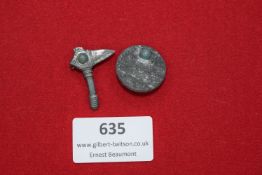 A two-piece set of Germanic revival badges, including a round shield badge and a hammer/axe motif