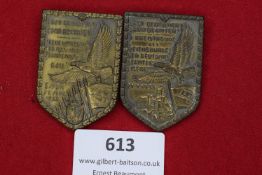 Two German Day Badges, 1934 and 1935, each featuring an eagle with outstretched wings above