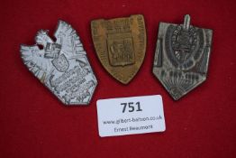 Three German day badges, including: silvered eagle-shaped badge for Schützenfest Mainz 1936,