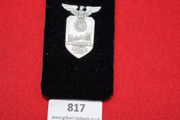 NSDAP 10 Year Badge, Achim, dated 26th May 1935, silvered tinnie with eagle and swastika over