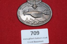 Large oval aluminium badge commemorating the “Grossflugtag” (Grand Flying Day), Frankfurt am Main,