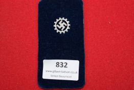 German Third Reich DAF cogwheel badge with swastika.