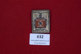 A 1936 NSDAP Gautreffen Gelsenkirchen commemorative badge, rectangular brass form with cloth insert,
