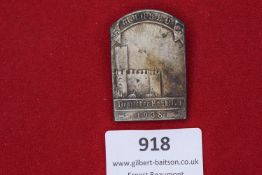 Deutscher Frontkämpfer Bund Day Badge 1938, rectangular tombak example depicting fortress scene with